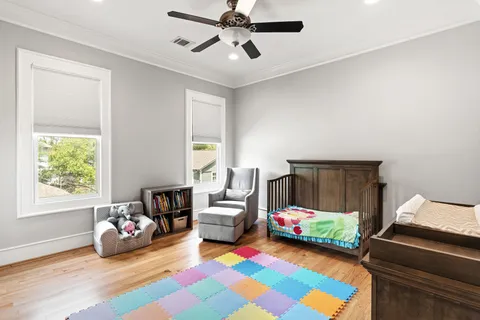 a bedroom with bed and a window