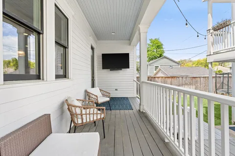 a view of a porch with furniture