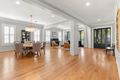a view of a dining room with furniture window and wooden floor