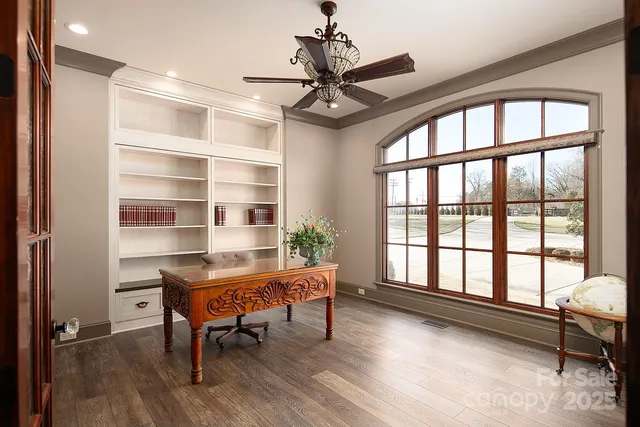 a bedroom with a bed mirror and window