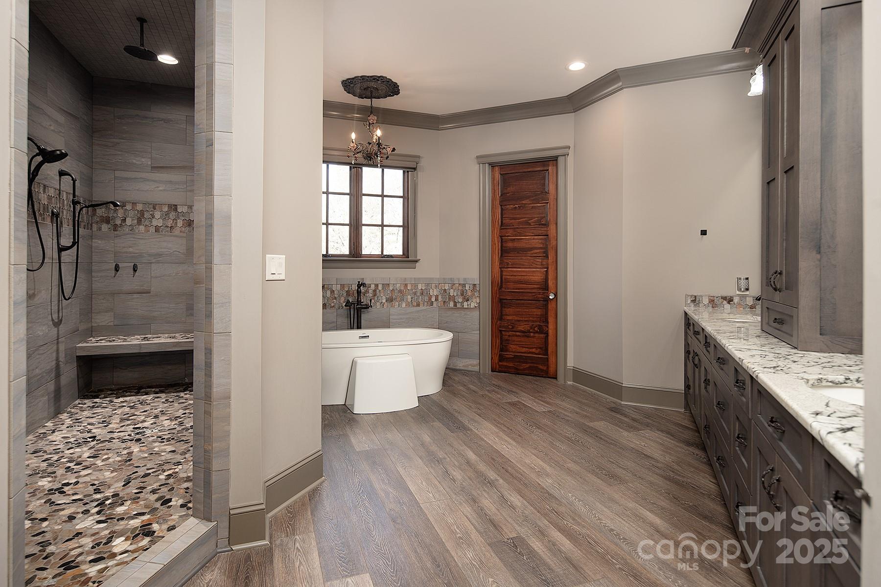 3200 Beaty Road Gastonia, NC 28056 - Photo 19 of 43 a bathroom with a bathtub sink and mirror