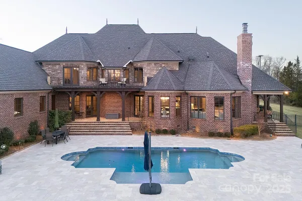 a front view of a house with swimming pool