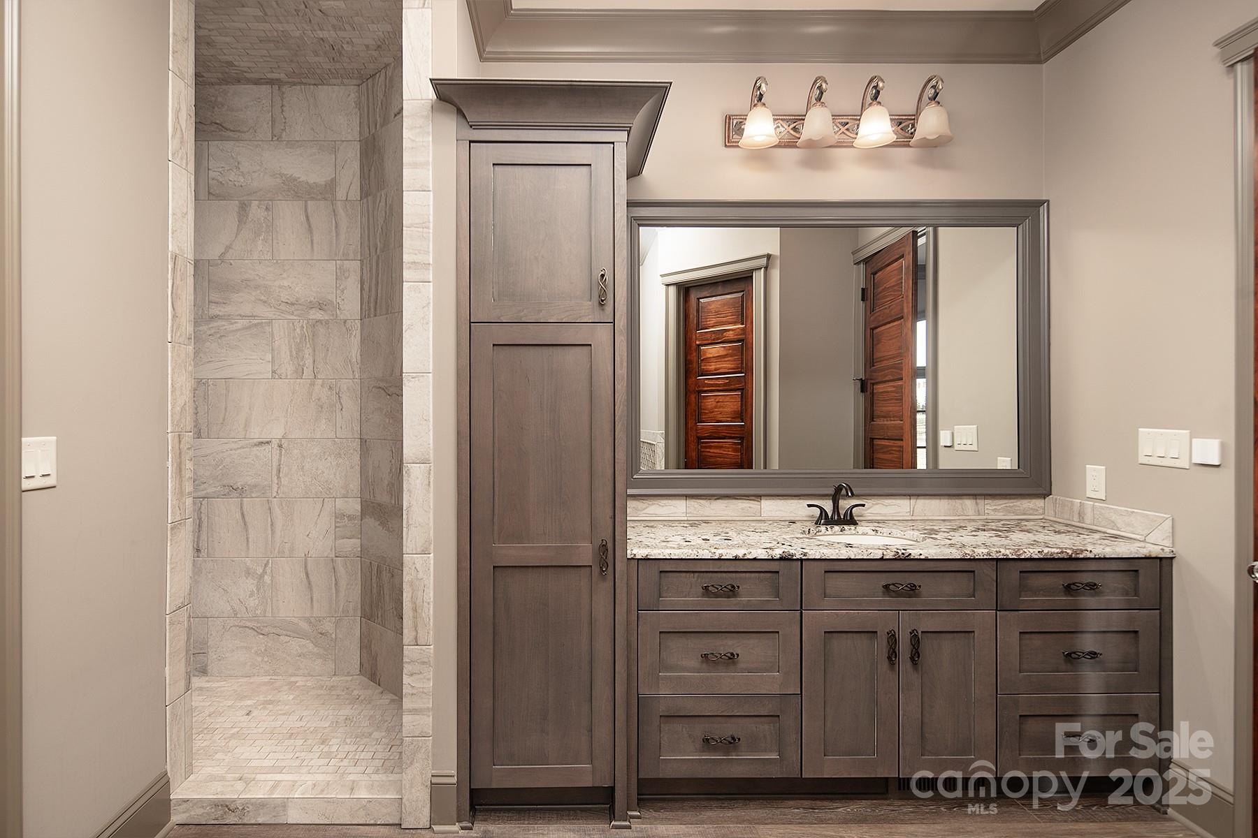 3200 Beaty Road Gastonia, NC 28056 - Photo 27 of 43 a bathroom with a sink and a mirror
