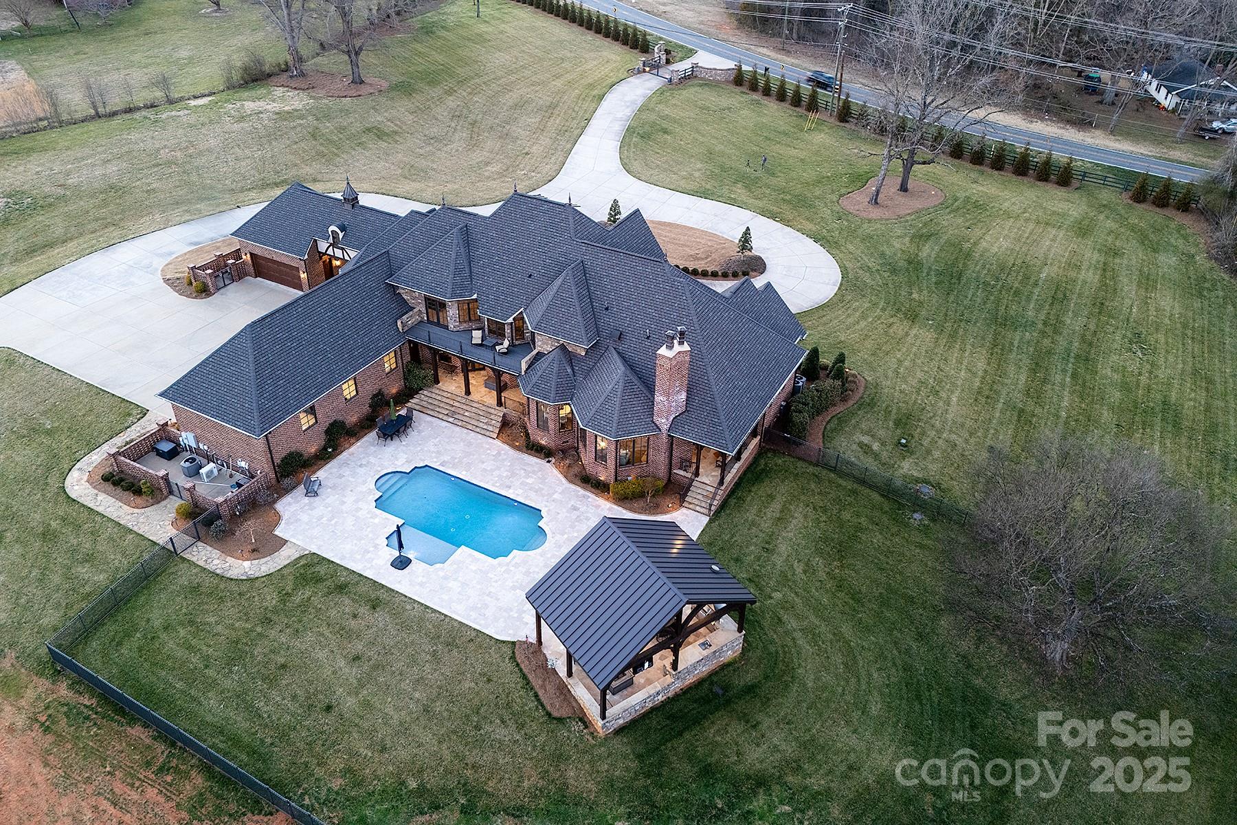 3200 Beaty Road Gastonia, NC 28056 - Photo 3 of 43 an aerial view of a house with a swimming pool