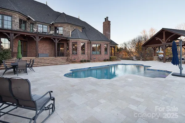 a patio with patio a couch and chairs