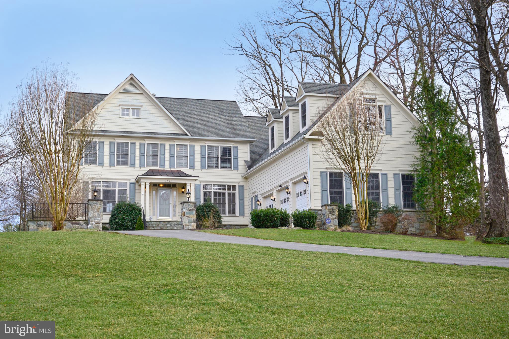 1763 Proffit Road Vienna, VA 22182 - Photo 1 of 30 a front view of a house with a garden