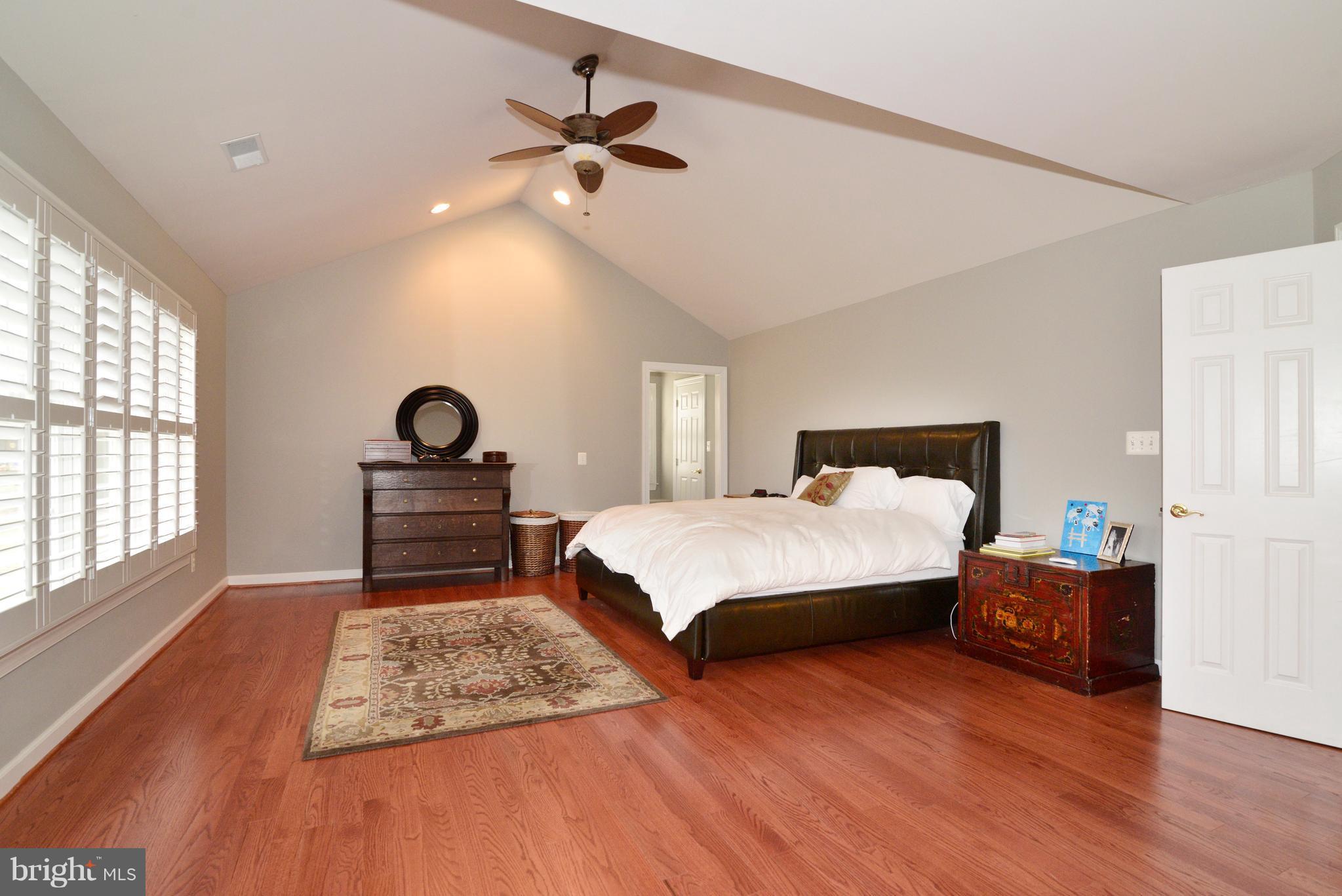 1763 Proffit Road Vienna, VA 22182 - Photo 2 of 30 a bedroom with a bed and a chandelier