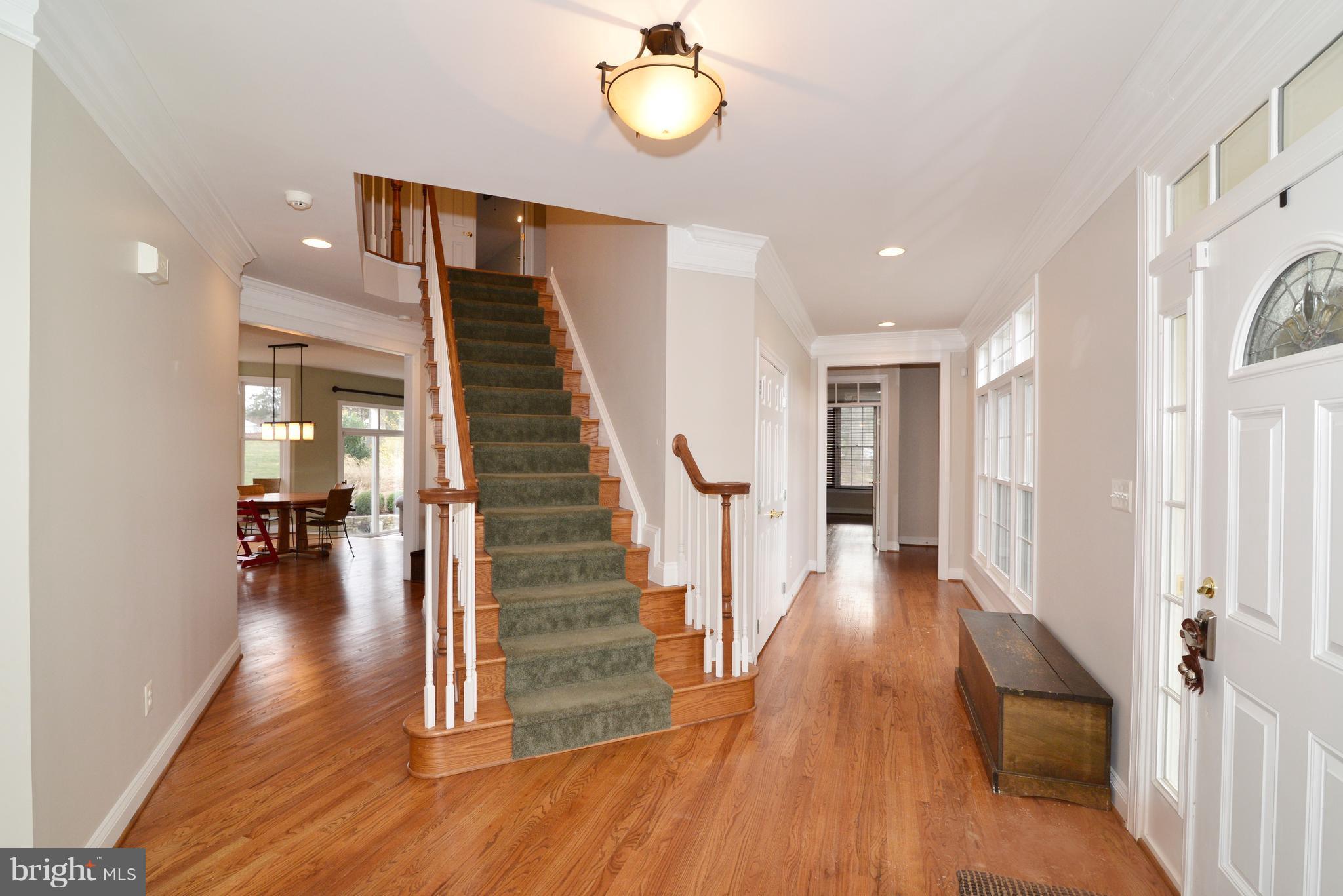 1763 Proffit Road Vienna, VA 22182 - Photo 12 of 30 a view of a hallway with wooden floor and staircase