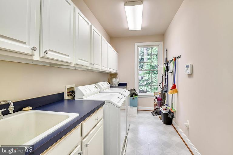 1763 Proffit Road Vienna, VA 22182 - Photo 20 of 30 a kitchen with a sink cabinets and window