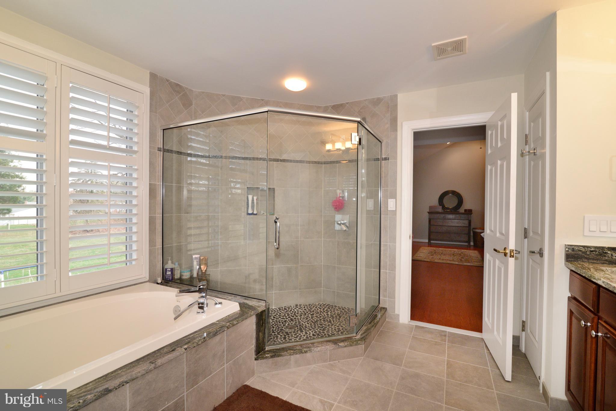 1763 Proffit Road Vienna, VA 22182 - Photo 3 of 30 a bathroom with a tub shower and sink
