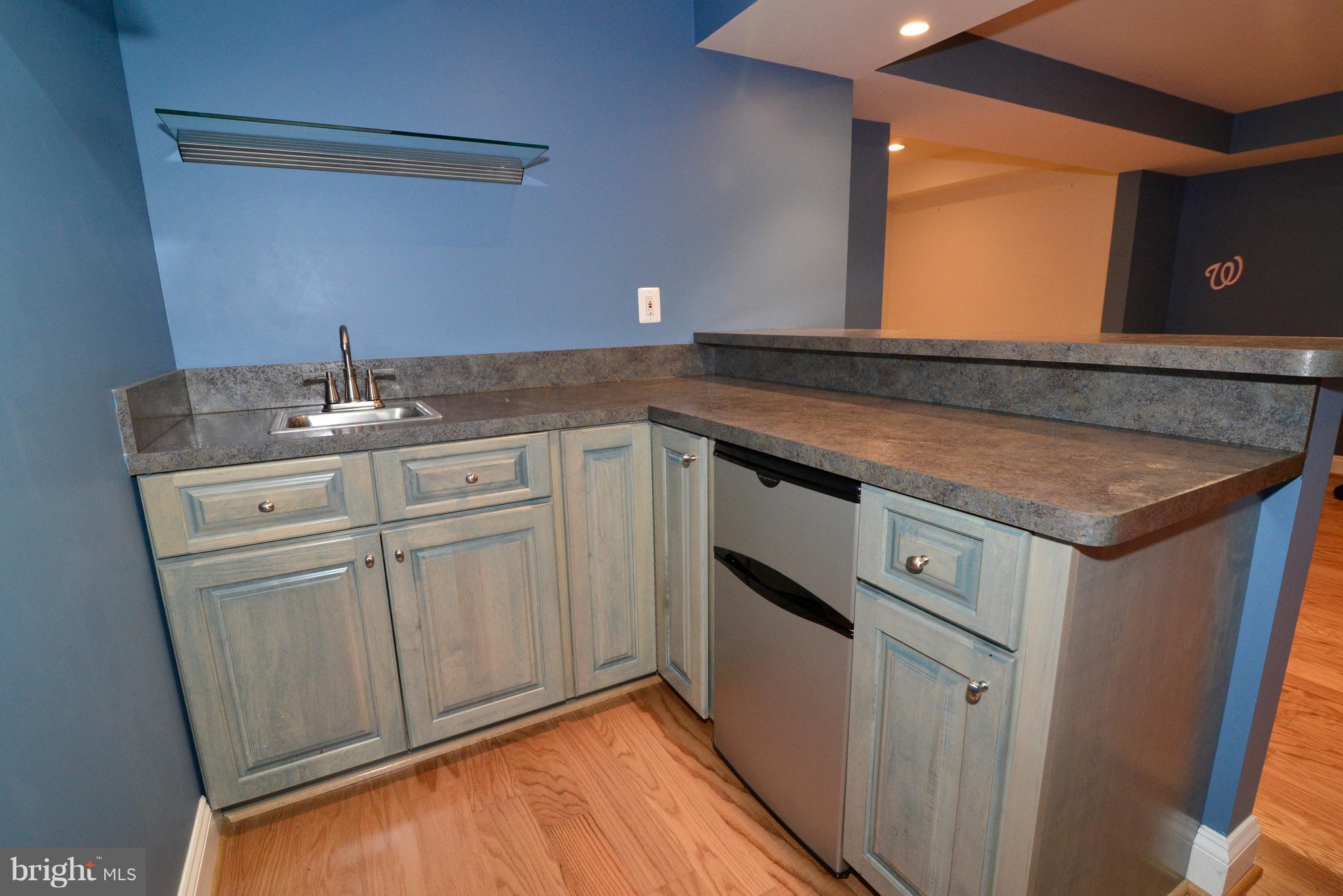 1763 Proffit Road Vienna, VA 22182 - Photo 24 of 30 a kitchen with a sink and cabinets