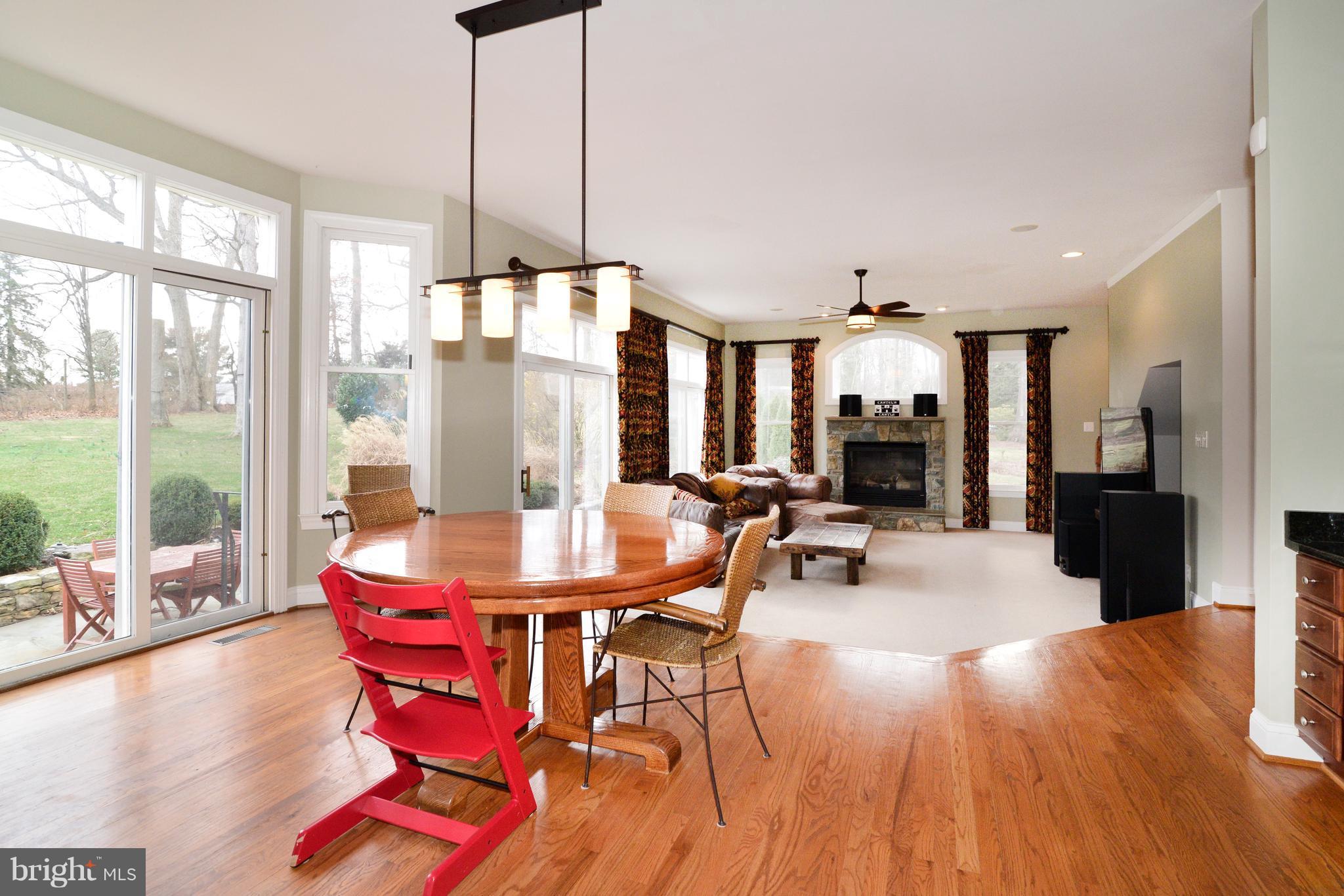 1763 Proffit Road Vienna, VA 22182 - Photo 10 of 30 a view of a dining room with furniture window and wooden floor