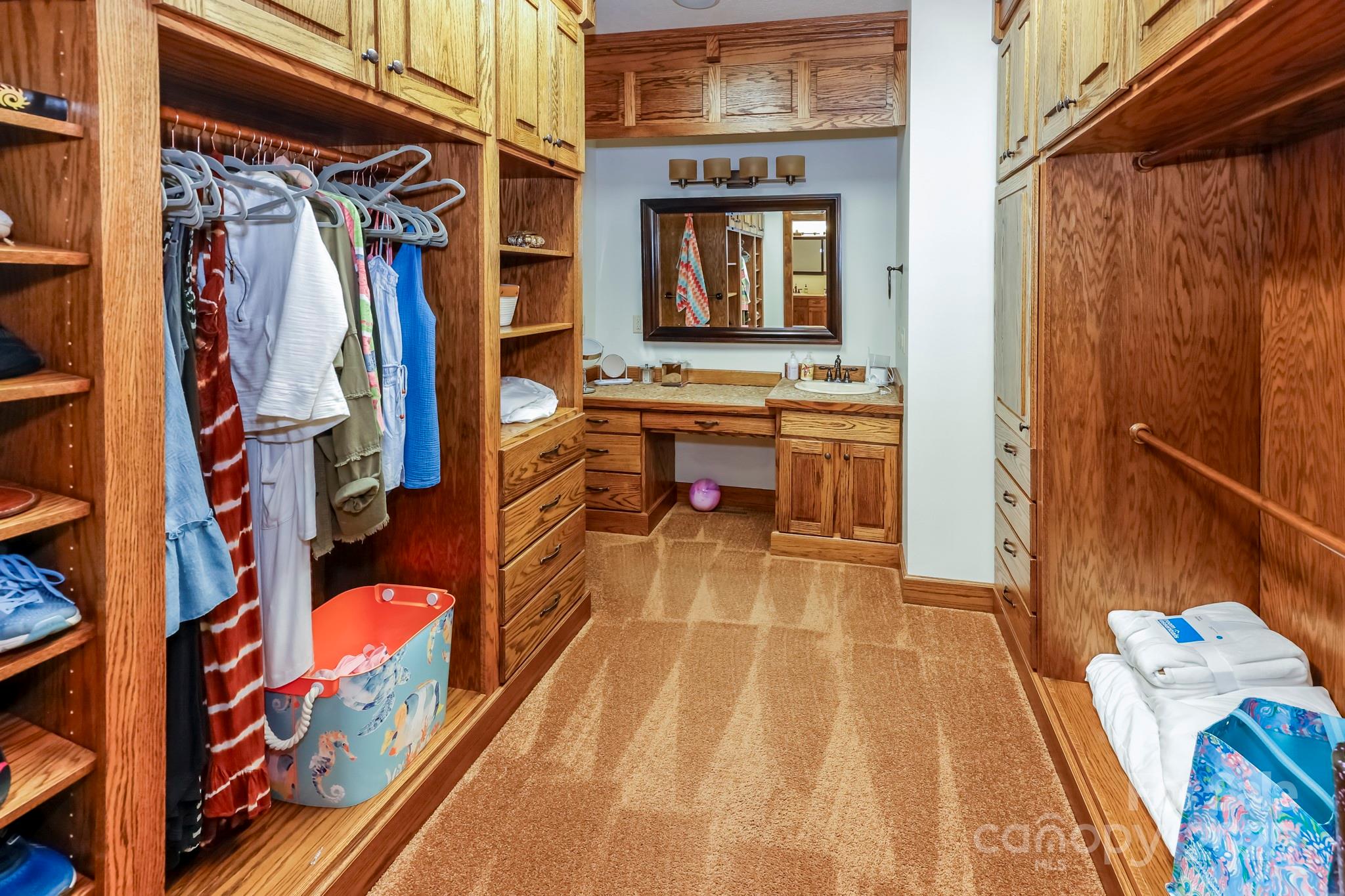 200 Chapel Point Road Lake Lure, NC 28746 - Photo 15 of 48 a view of walk in closet with clothes and shoes