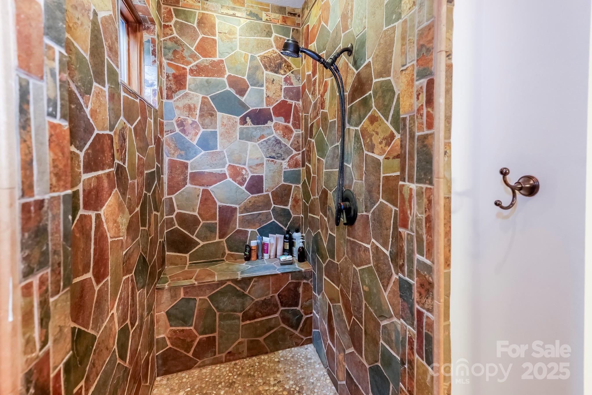 200 Chapel Point Road Lake Lure, NC 28746 - Photo 17 of 48 a bathroom with a shower and a sink