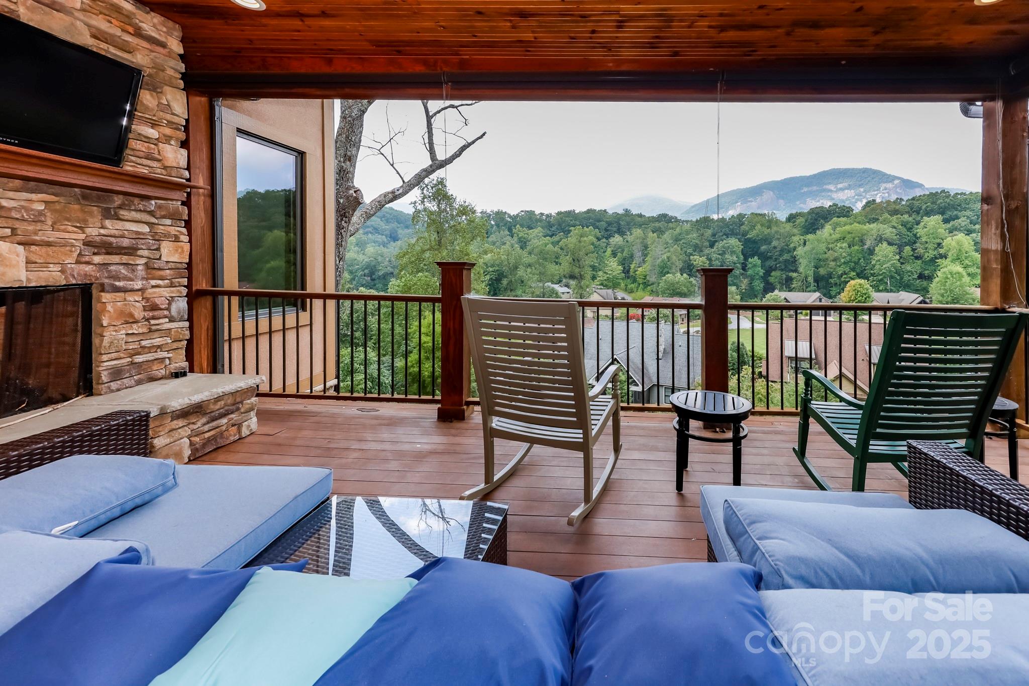 200 Chapel Point Road Lake Lure, NC 28746 - Photo 20 of 48 a view of a patio with couches table and chairs