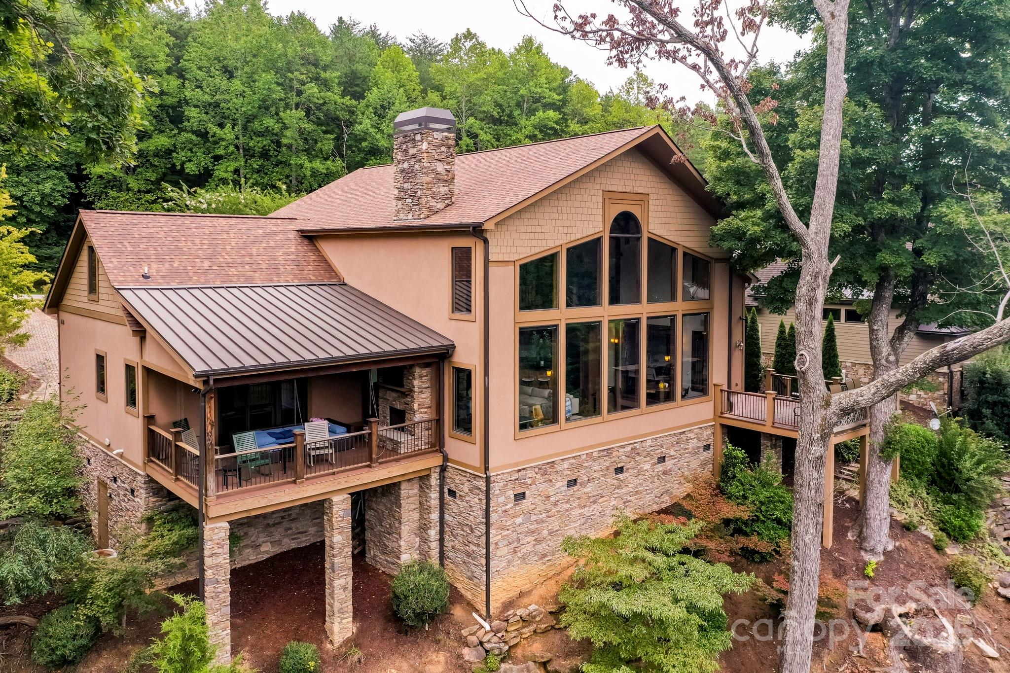 200 Chapel Point Road Lake Lure, NC 28746 - Photo 2 of 48 a front view of a house with a yard
