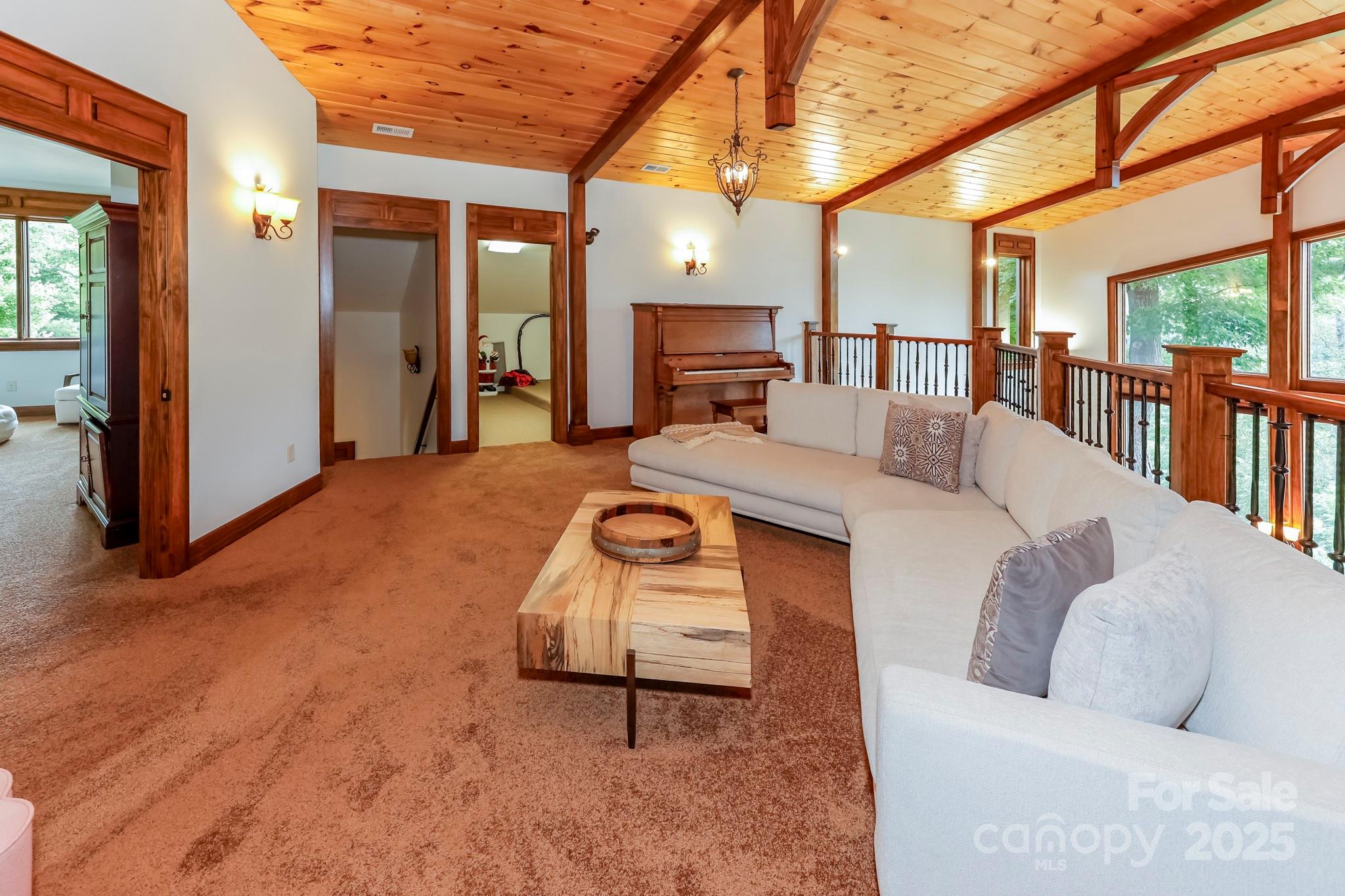 200 Chapel Point Road Lake Lure, NC 28746 - Photo 26 of 48 a living room with furniture and a fireplace