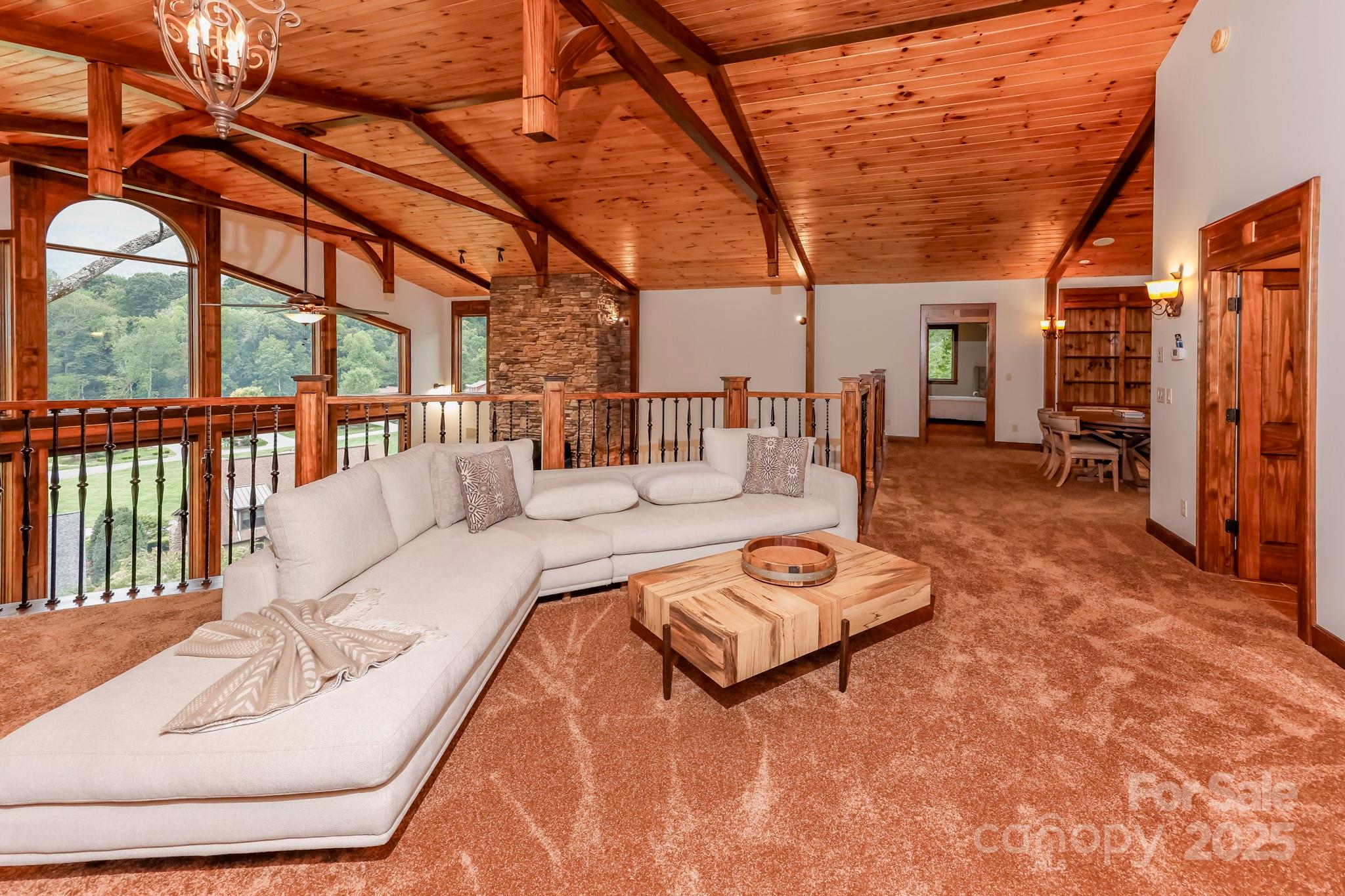 200 Chapel Point Road Lake Lure, NC 28746 - Photo 27 of 48 a outdoor space with the couches and dining table with chairs