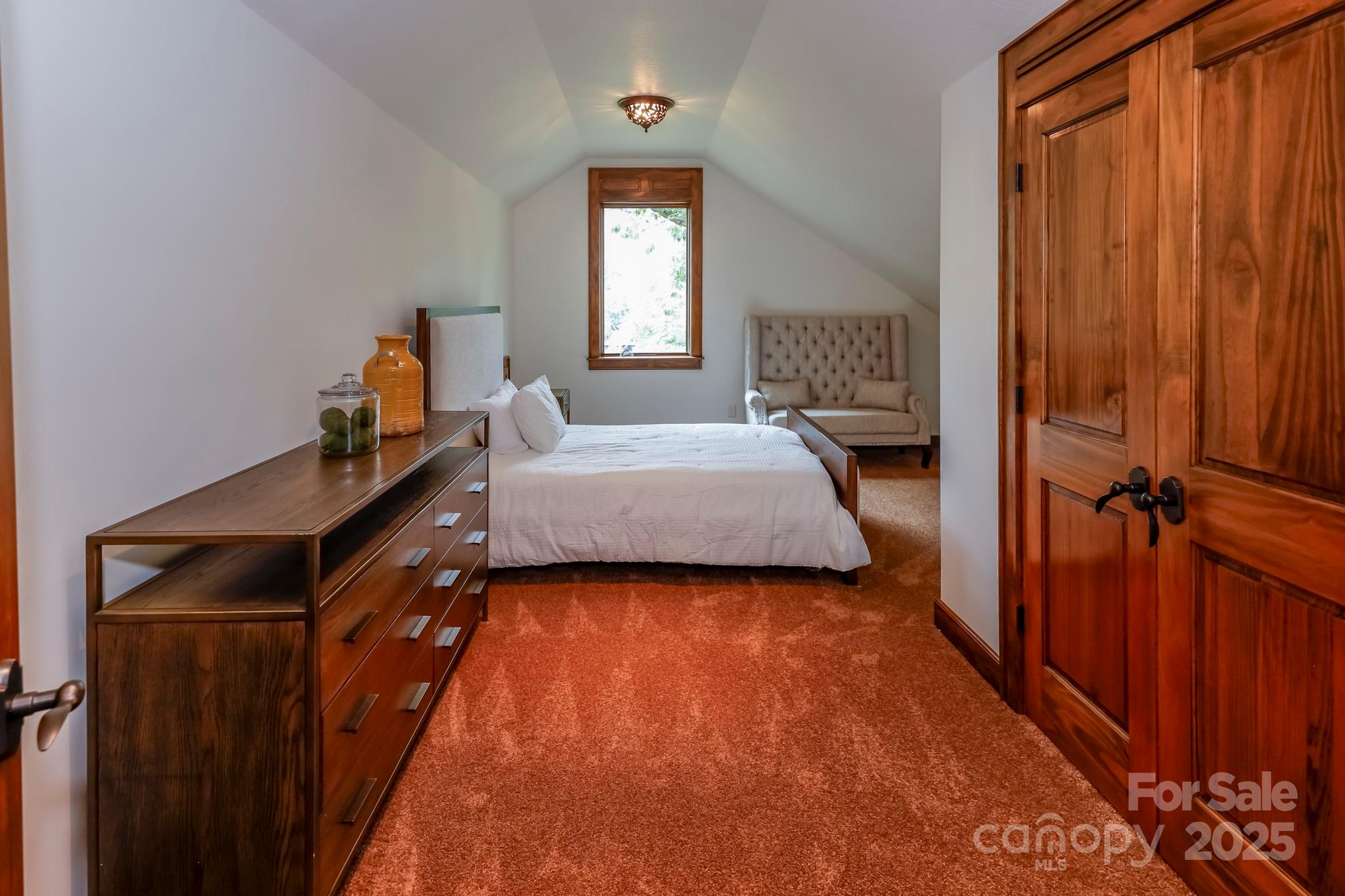 200 Chapel Point Road Lake Lure, NC 28746 - Photo 28 of 48 a bedroom with a bed and a window