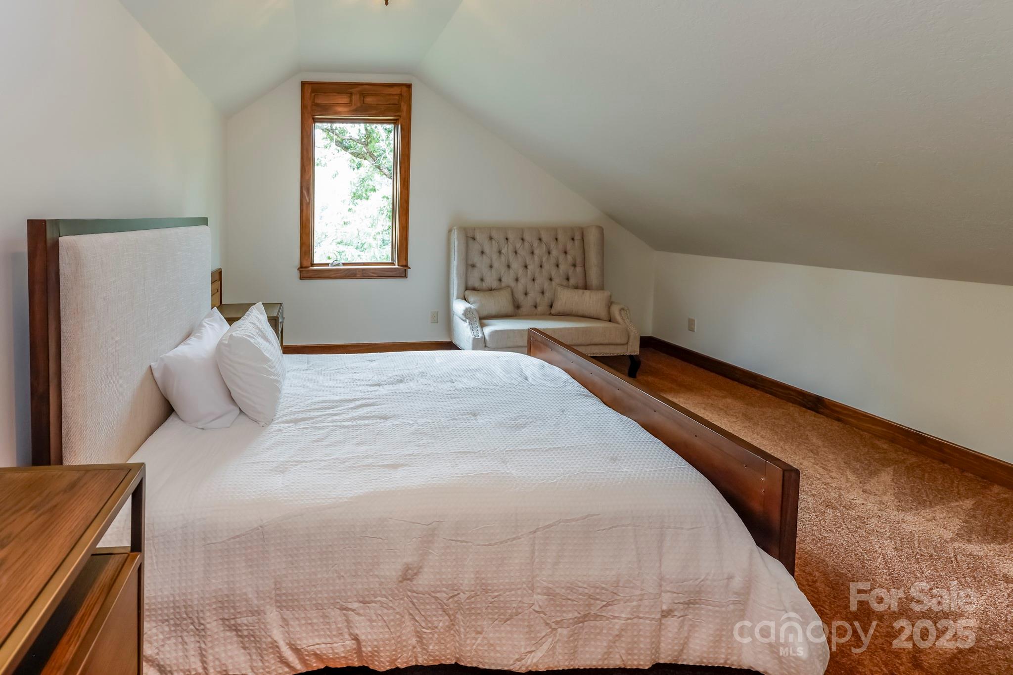 200 Chapel Point Road Lake Lure, NC 28746 - Photo 29 of 48 a bedroom with a bed and a window
