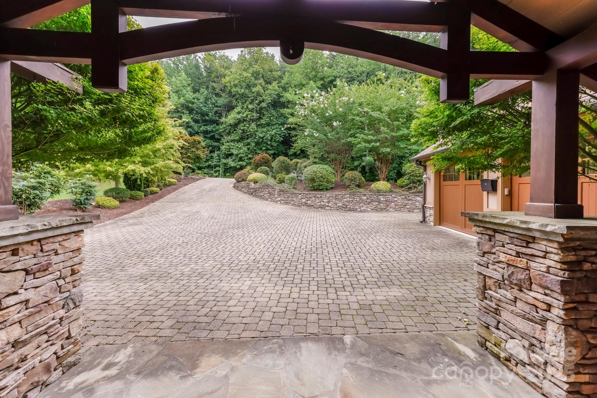 200 Chapel Point Road Lake Lure, NC 28746 - Photo 40 of 48 a sidewalk with a trees in the back yard