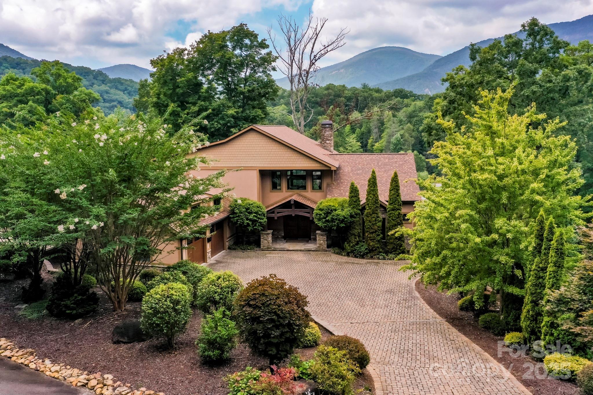 200 Chapel Point Road Lake Lure, NC 28746 - Photo 48 of 48 a front view of a house with a yard and potted plants
