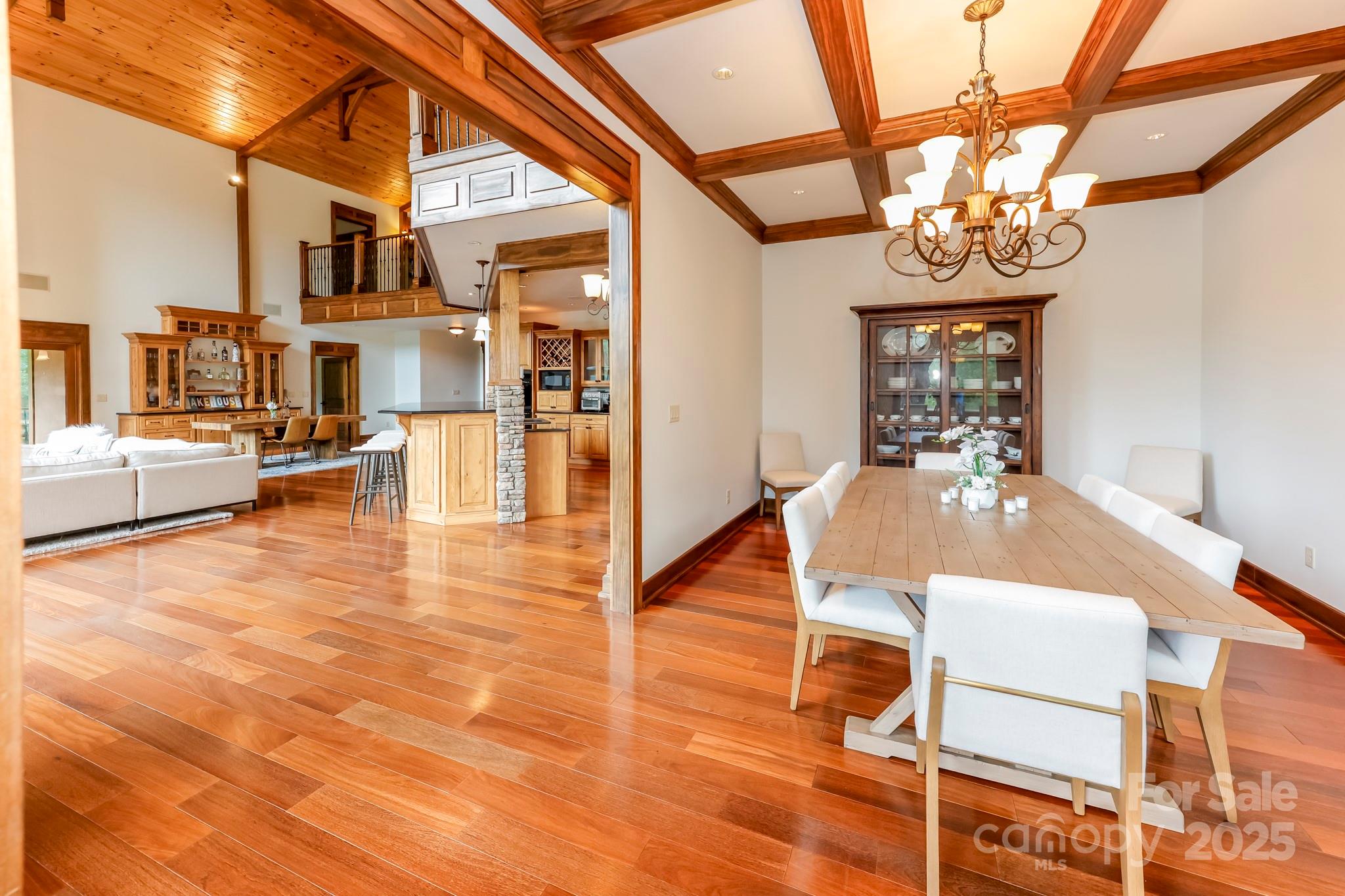 200 Chapel Point Road Lake Lure, NC 28746 - Photo 10 of 48 a view of a dining room with furniture and a chandelier
