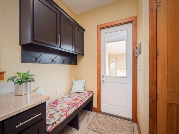 a living room with furniture and flowers