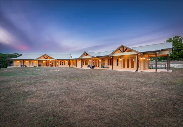 a view of a large house with a yard