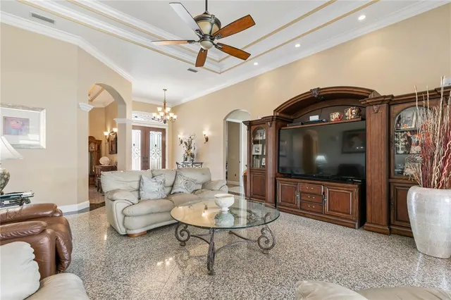 a view of a dining room with furniture and chandelier
