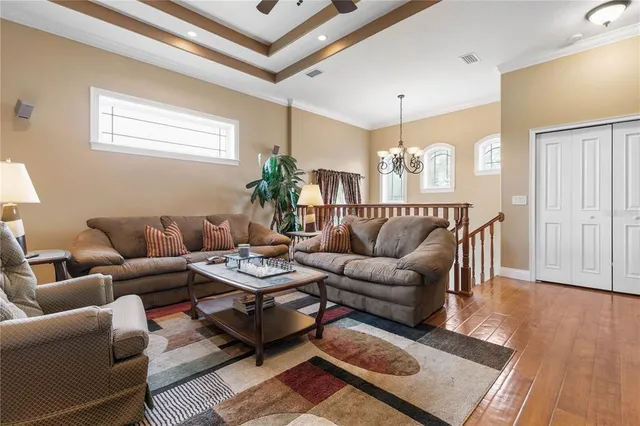 a dining room with furniture a chandelier and fireplace