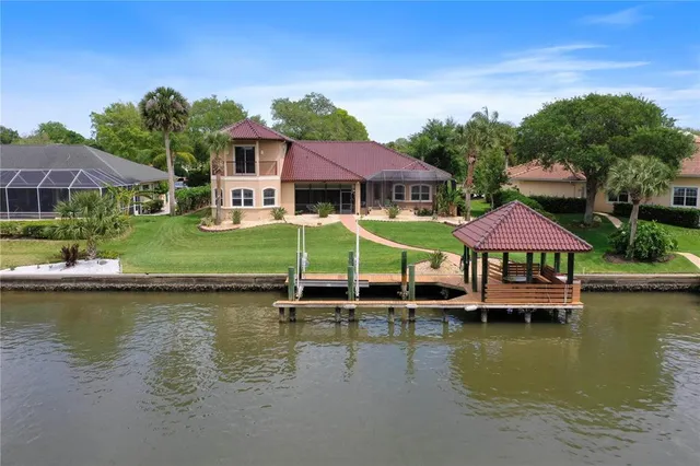 a view of a porch with furniture and garden