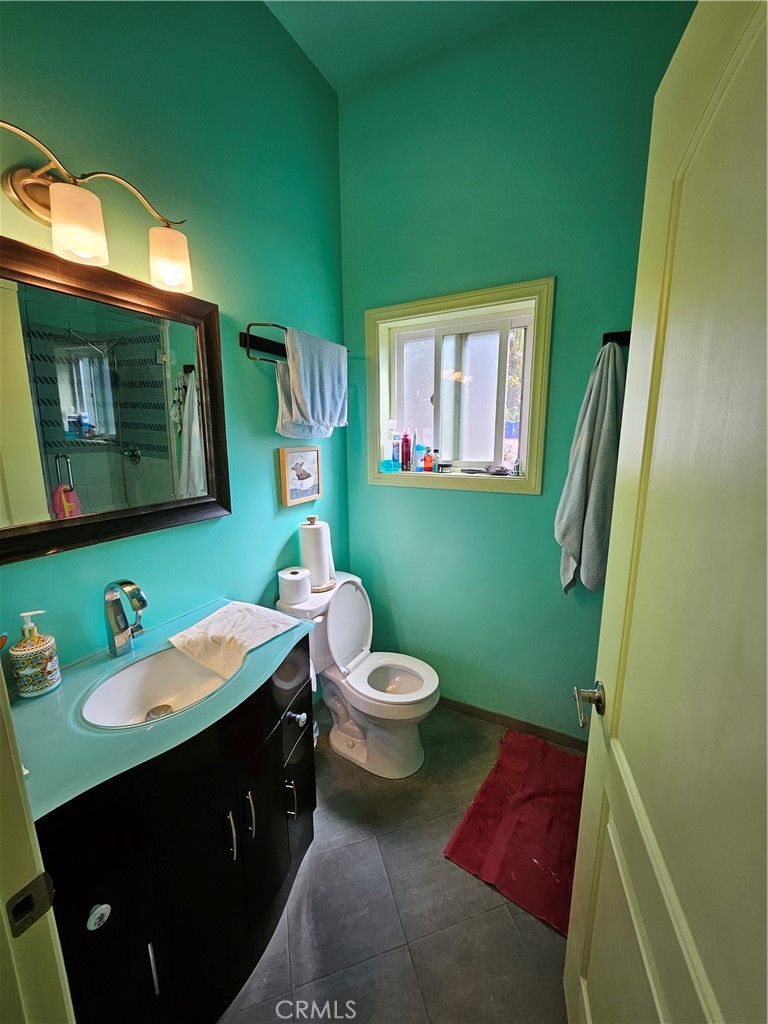 9740 La Canada Way Shadow Hills, CA 91040 - Photo 15 of 28 a bathroom with a toilet sink and mirror