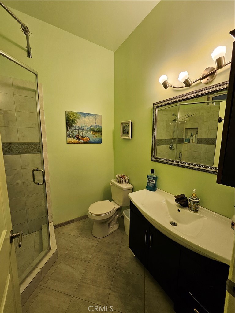 9740 La Canada Way Shadow Hills, CA 91040 - Photo 16 of 28 a bathroom with a sink and a mirror