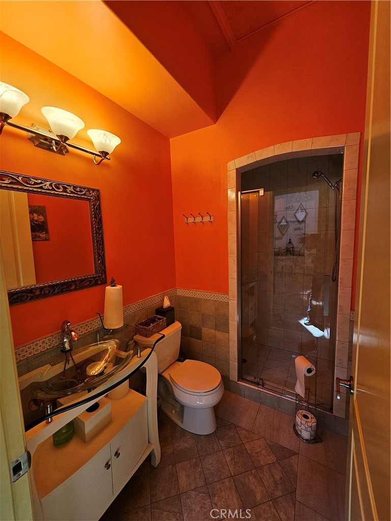 9740 La Canada Way Shadow Hills, CA 91040 - Photo 17 of 28 a bathroom with a toilet and a shower