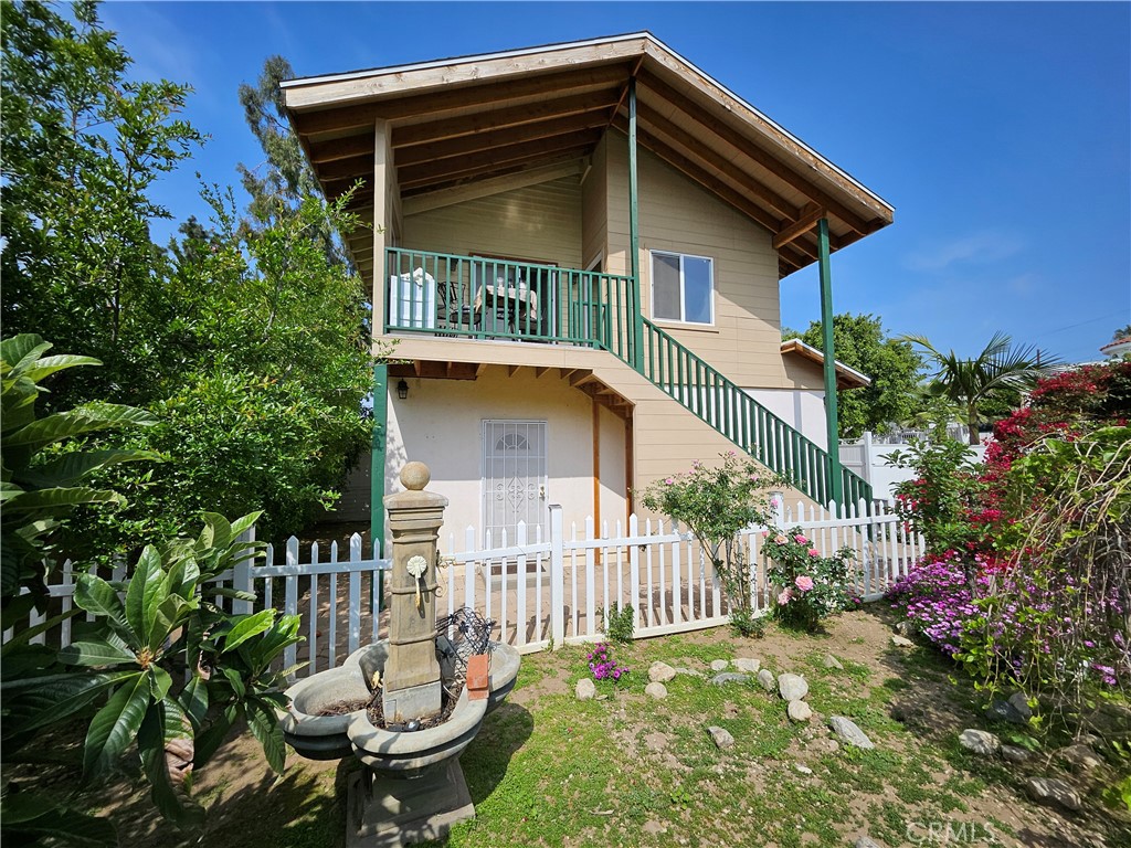 9740 La Canada Way Shadow Hills, CA 91040 - Photo 21 of 28 a front view of a house with a yard