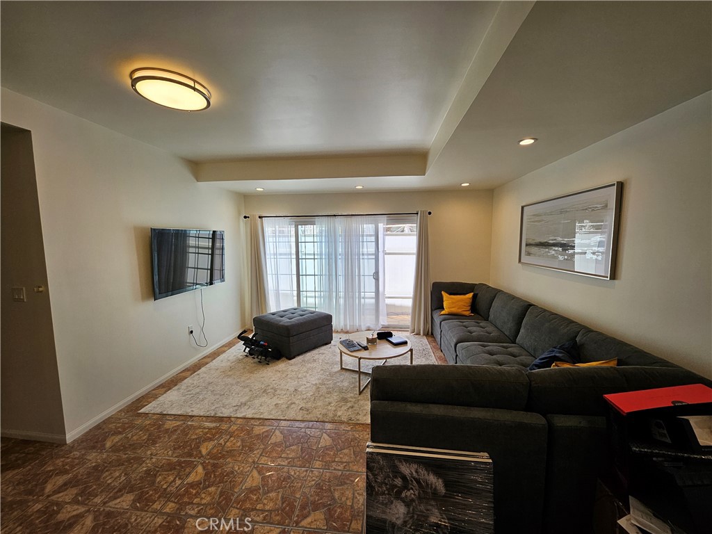 9740 La Canada Way Shadow Hills, CA 91040 - Photo 22 of 28 a living room with furniture and a window