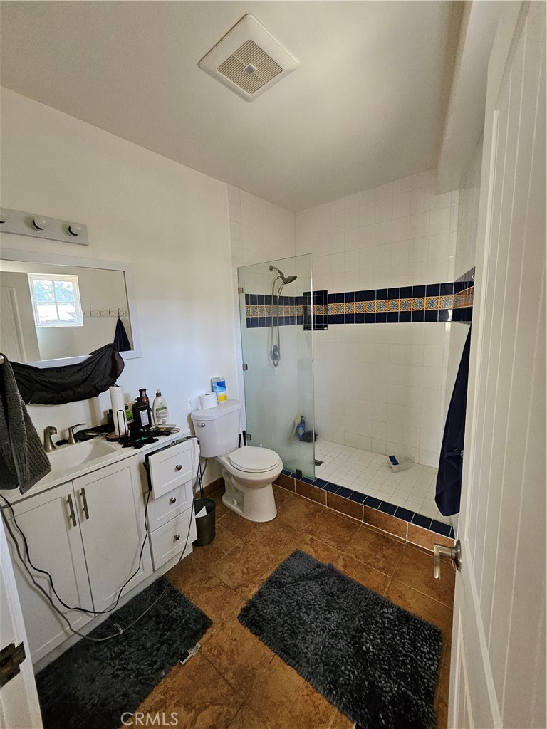 9740 La Canada Way Shadow Hills, CA 91040 - Photo 24 of 28 a living room with furniture and a rug