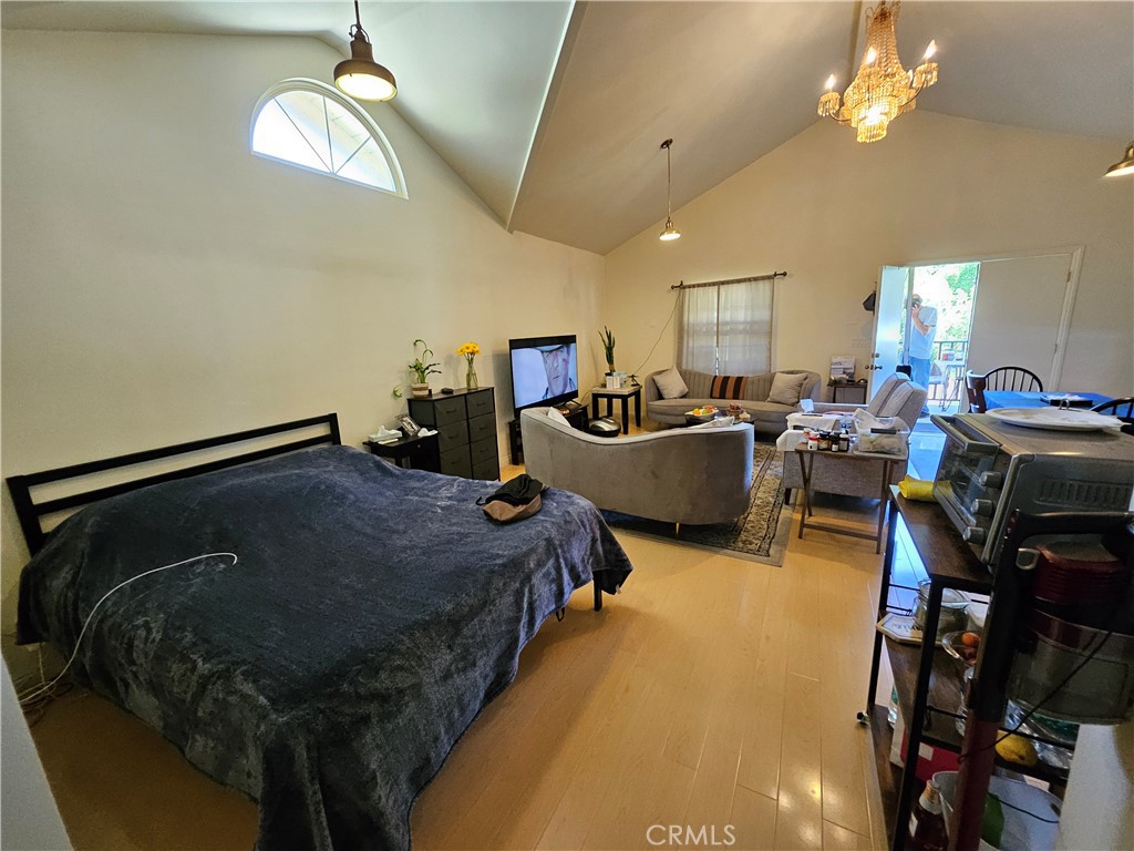 9740 La Canada Way Shadow Hills, CA 91040 - Photo 26 of 28 a bed room with a bed furniture and a gym equipment