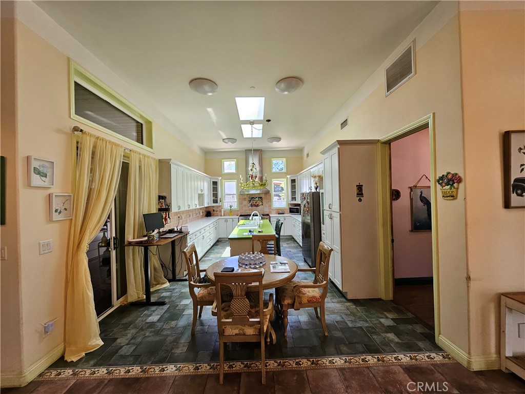 9740 La Canada Way Shadow Hills, CA 91040 - Photo 10 of 28 a view of a dining room with furniture and a refrigerator