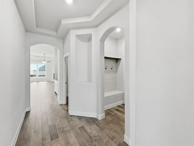 wooden floor in a white room