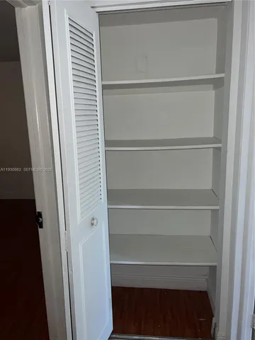 a view of a room with racks on the wall