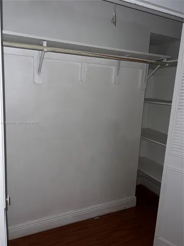 a bathroom with a shower and a toilet