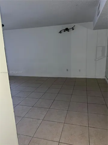 a view of street with parked cars