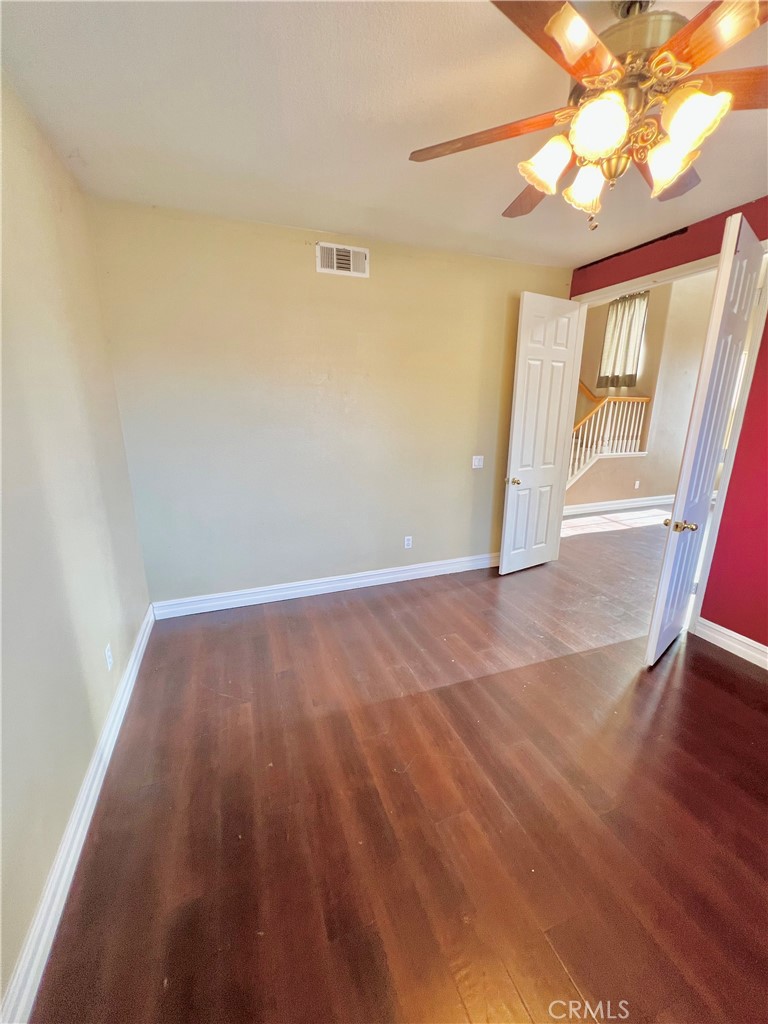 27145 Cherry Grove Court Temecula, CA 92591 - Photo 14 of 61 wooden floor in an empty room with a window