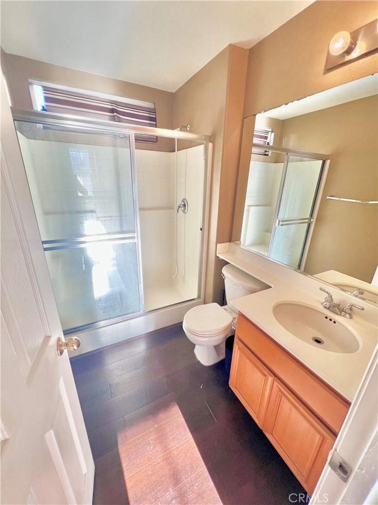 27145 Cherry Grove Court Temecula, CA 92591 - Photo 15 of 61 a bathroom with a sink a toilet and shower