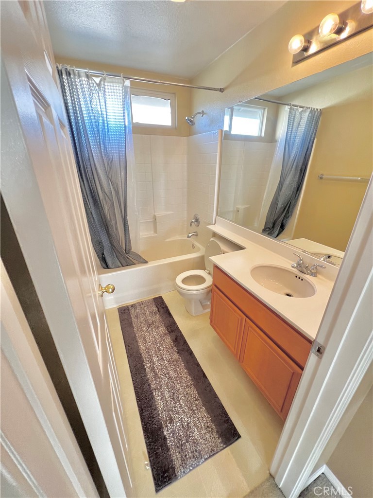 27145 Cherry Grove Court Temecula, CA 92591 - Photo 35 of 61 a bathroom with a sink a vanity and a mirror