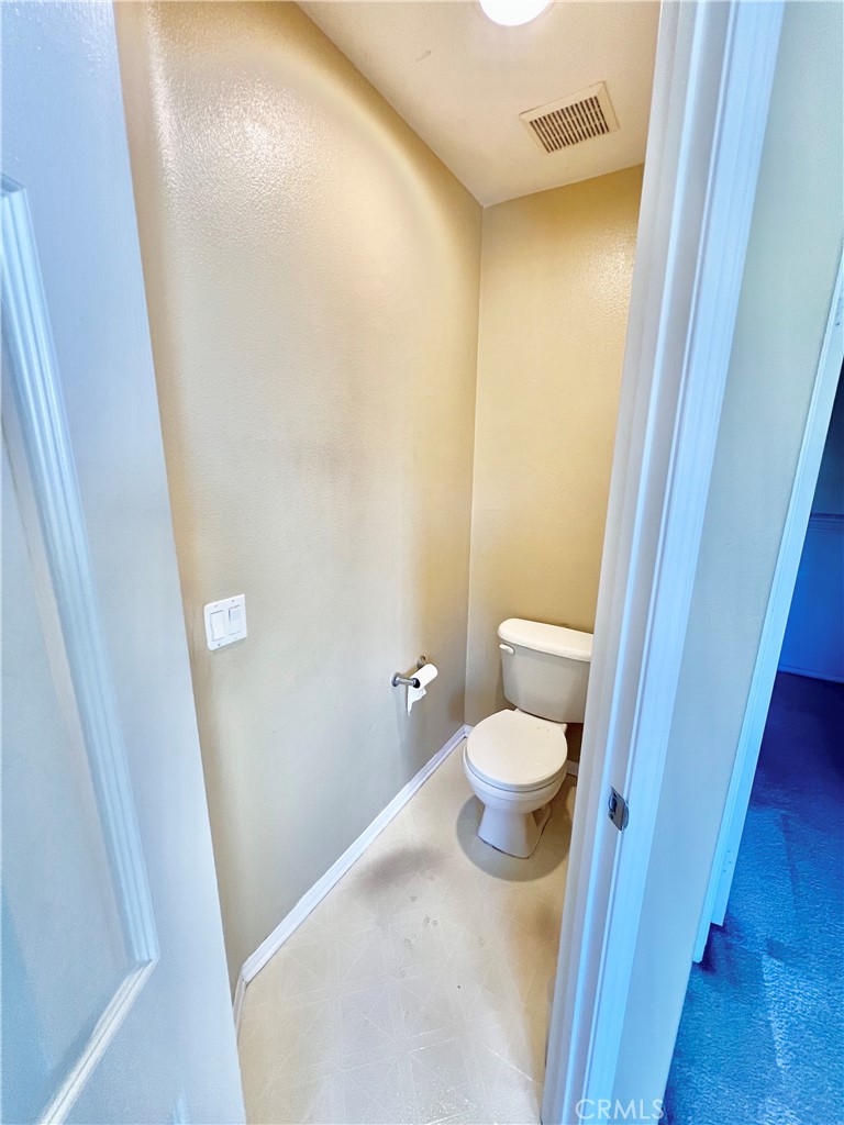 27145 Cherry Grove Court Temecula, CA 92591 - Photo 42 of 61 a bathroom with a granite countertop toilet and a sink