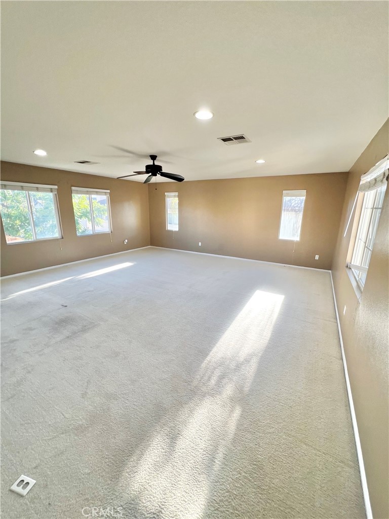 27145 Cherry Grove Court Temecula, CA 92591 - Photo 47 of 61 an empty room with a empty space and windows