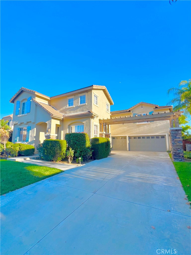 27145 Cherry Grove Court Temecula, CA 92591 - Photo 61 of 61 a front view of a house with a yard and garage